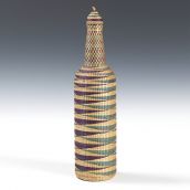 Tutsi woven basketry covered glass bottle